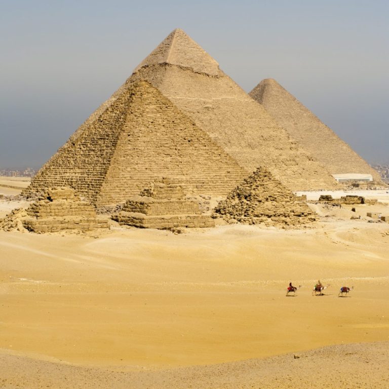 Three pyramids in the desert with a clear sky- affordable medical tourism provider UK- plastic surgery in UK cheap prices 